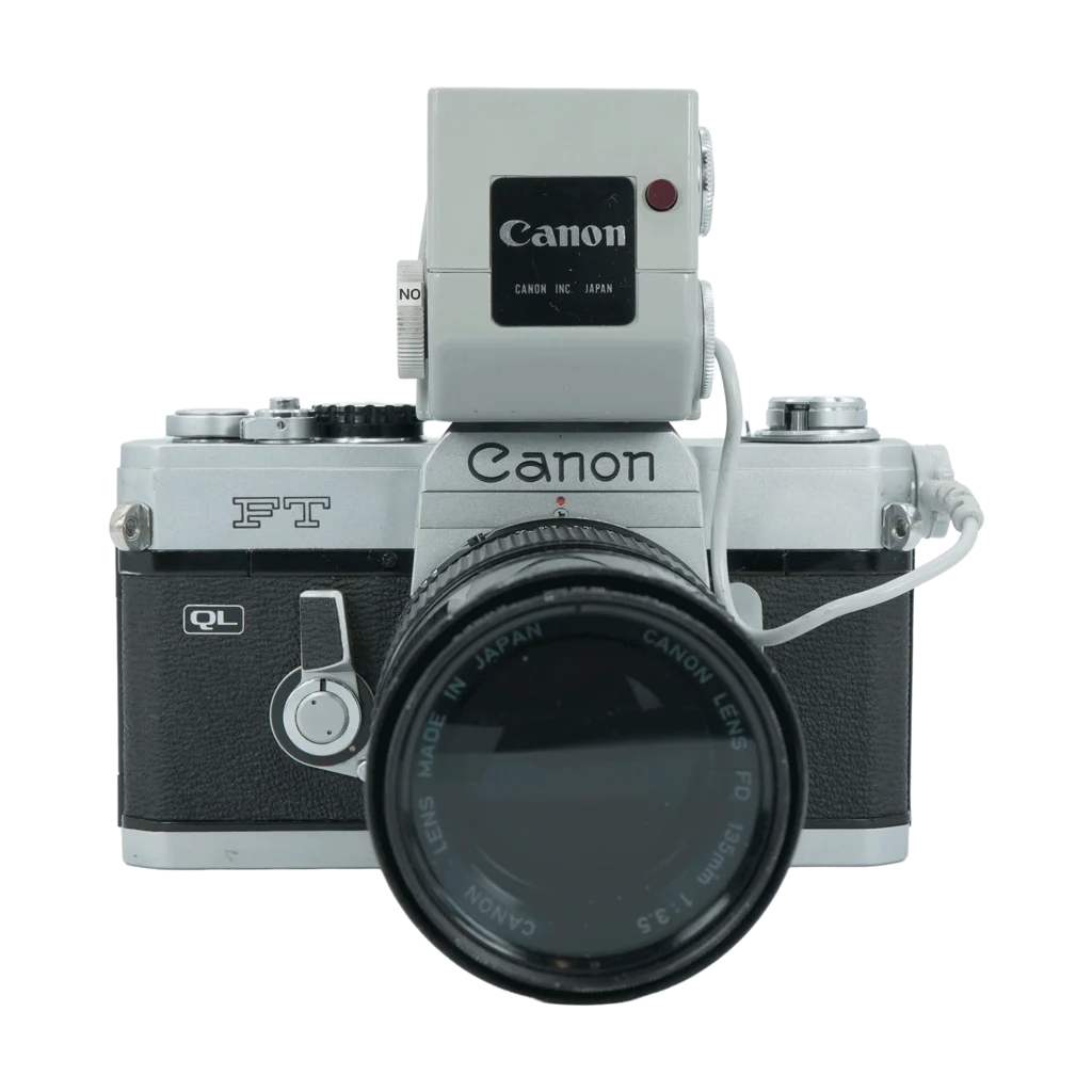 CanonFT QL 35mm Film Camera with Light Meter Booster andFD 135mm f/3.5 Lens